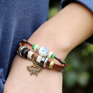 Handmade multilayer leather bracelet with bronze butterfly pendant and ceramic beads