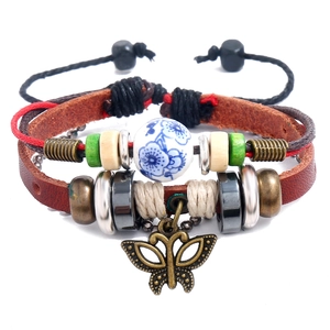 Multilayer vintage leather bracelet featuring butterfly pendant and ceramic beads