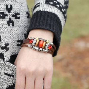 Bohemian multilayer brown leather bracelet featuring red gemstones and silver carvings