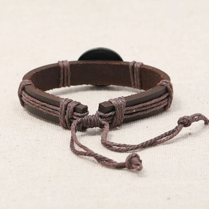 Adjustable vintage dark brown leather bracelet with woven hemp rope and metal badge