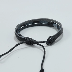 Minimalist double-layered black woven leather bracelet with adjustable cord closure