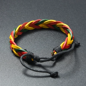 Detail of red yellow and green braided leather bracelet with adjustable black cords