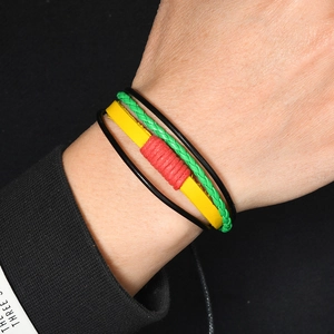 Multilayer braided leather bracelet with red, yellow, and green reggae color accents