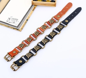Macro detail of punk leather bracelets featuring eagle relief bronze alloy ornaments