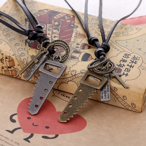 Vintage punk leather necklace with saw and cross pendants in antique silver and bronze