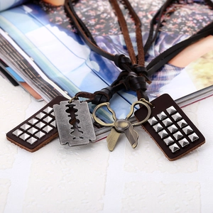 Retro punk leather necklace featuring silver pyramid studs with razor blade and scissor charms
