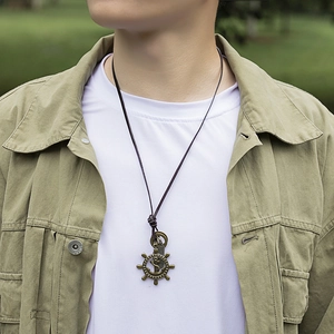 Vintage bronze nautical rudder and anchor pendant on adjustable brown leather necklace