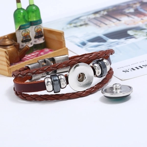 Macro view of vintage braided leather bracelet with interchangeable metal snap button