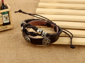 Detail view of multi-layer leather bracelet with cross rivets and adjustable cords