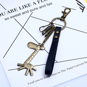 Vintage bronze giraffe alloy keychain with black leather strap and multi-hook design
