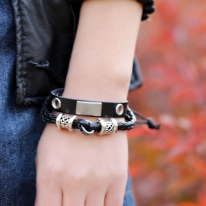 Two-piece punk style black leather bracelet set with metallic plate and Celtic knot beads