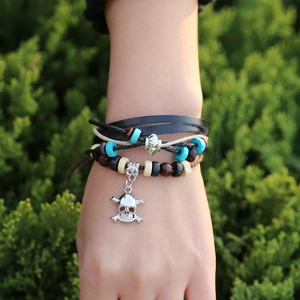Retro punk multi-layer leather bracelet with blue beads and a silver skull charm