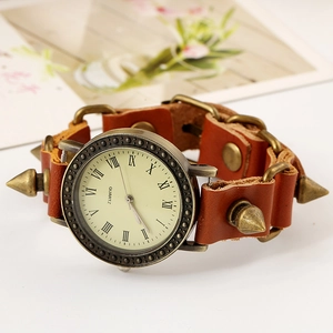 Vintage punk brown leather strap watch featuring bronze metal studs and spikes
