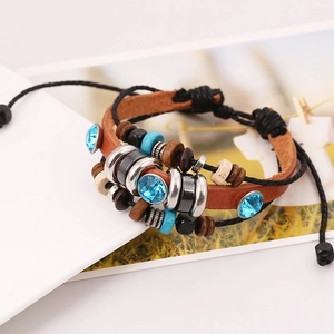 Bohemian multi-layer leather bracelet featuring brown leather, wood beads and blue crystals