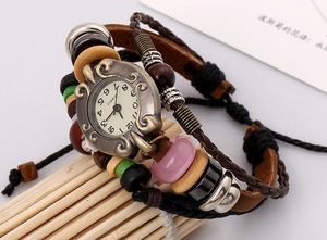 Macro shot of vintage leather bracelet watch with bronze dial and colorful ethnic beads
