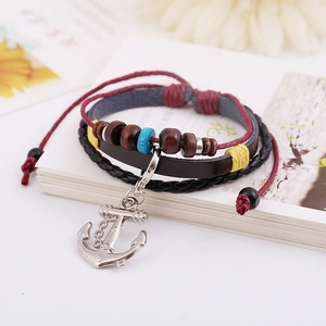 Handmade multilayer leather bracelet featuring wooden beads and silver anchor pendant