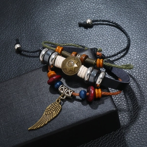 Retro multi-layer leather bracelet set with bronze feather charm and beaded accents