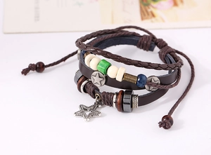 Detail of multi-layer leather bracelet with star charms and vintage beads