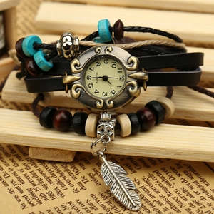 Vintage bohemian leather wrap watch with turquoise beads and silver feather pendant