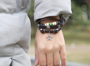 Macro view of multi-layer leather bracelet with star charm and colorful beads on wrist