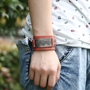 Men's punk leather bracelet with vintage alloy shields and orange-brown strap