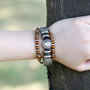 Handmade leather multi-layer bracelet with wooden beads and silver star pendants