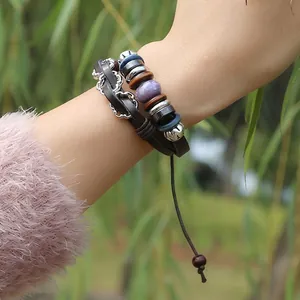 Bohemian multilayer braided leather bracelet with vintage beads and metal charms