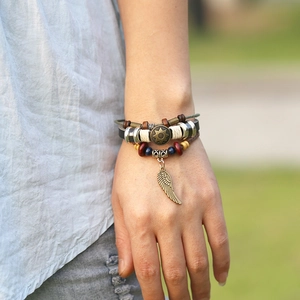 Vintage multilayer leather bracelet with feather charm and sun metal disc for men