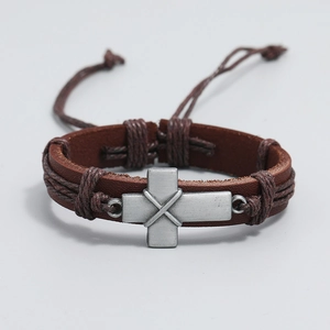 Retro brown braided leather bracelet with a brushed metal cross and adjustable drawstring