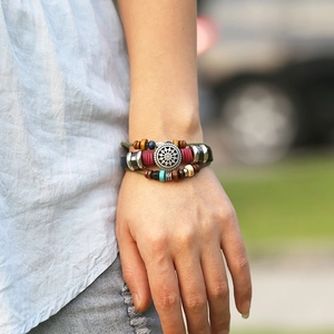 Vintage bohemian multilayer leather bracelet with turquoise beads and sun charm