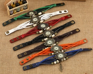 Retro handmade braided leather bracelet watch set with vintage bronze dial on jute background