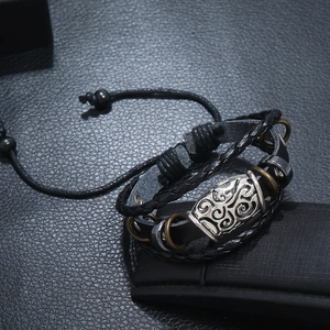 Men's retro braided leather bracelet with Celtic spiral bead and adjustable cord