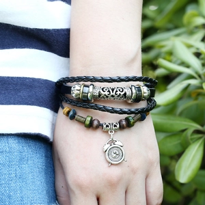 Black multilayer leather bracelet featuring alarm clock charm and colorful beads