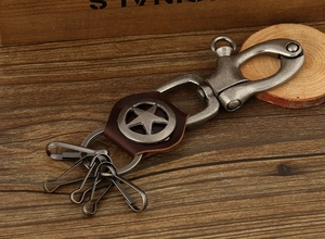 Retro punk style cowhide leather keychain featuring metal star pendant and spring hooks