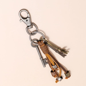 Retro leather tassel keychain with industrial metal carabiner and antique key charms