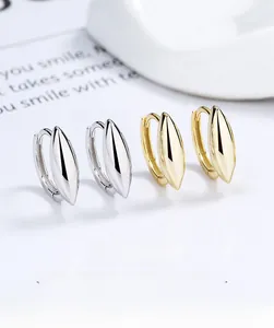 Detailed view of 925 sterling silver rhombus drop hoop earrings in gold and silver