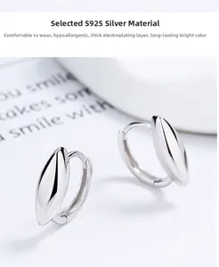 Detailed view of polished S925 sterling silver hoop earrings with elegant leaf shape design