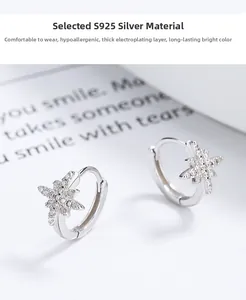 Detailed view of S925 sterling silver star earrings with sparkling zircon stones