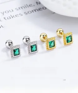 Detail of square emerald zircon earrings with 925 silver screw back in gold and silver