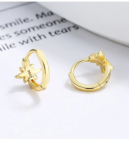 Detailed close-up of S925 sterling silver gold star hoop earrings with S925 hallmark