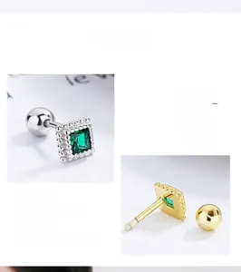 Detailed macro view of S925 sterling silver square emerald earrings with screw ball backs