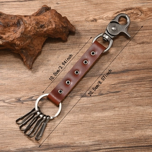 Vintage brown leather skull keychain with metal hooks and 20.5cm length measurement