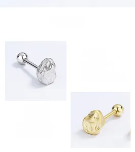 Detailed macro view of 925 sterling silver irregular molten textured stud earrings
