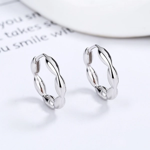 Minimalist 925 sterling silver hoop earrings with wave texture and polished finish