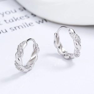 Elegant 925 sterling silver twisted hoop earrings with micro-pave zirconia crystals