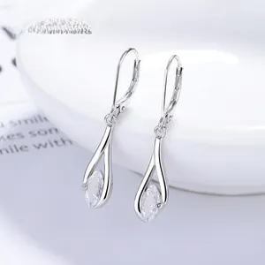 Detailed macro of 925 sterling silver drop earrings with marquise-cut zircon stones