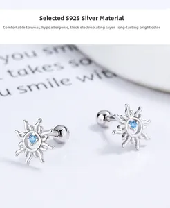 Detailed macro view of S925 silver sun earrings featuring round blue zircon gemstones
