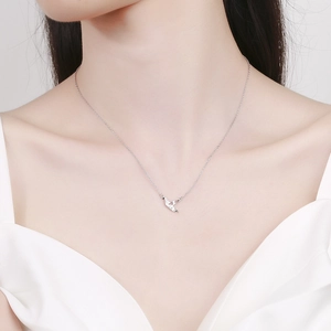 925 silver origami crane necklace pendant on model with minimalist delicate chain