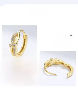 Detailed view of S925 sterling silver golden bow hoop earrings with micro zircon inlay