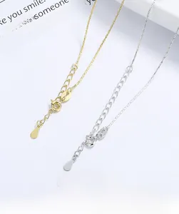Detail of 925 sterling silver bamboo chain with lobster clasp in gold and silver